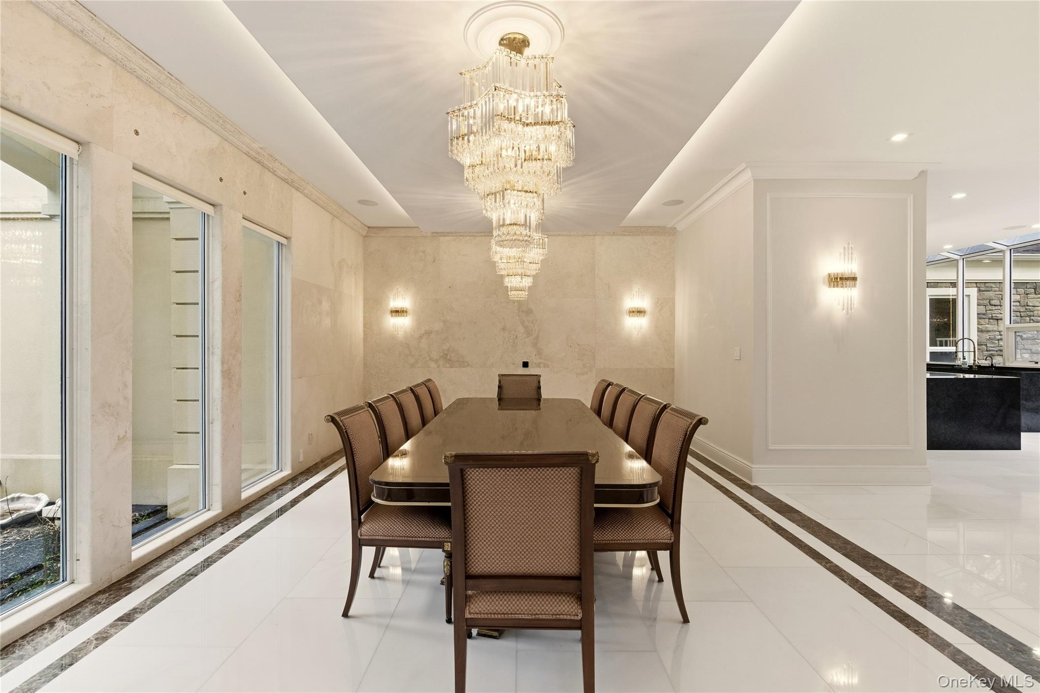 55 Coves Run Syosset, NY 11791 - Photo 11 of 50 a view of a dining room with furniture and a chandelier