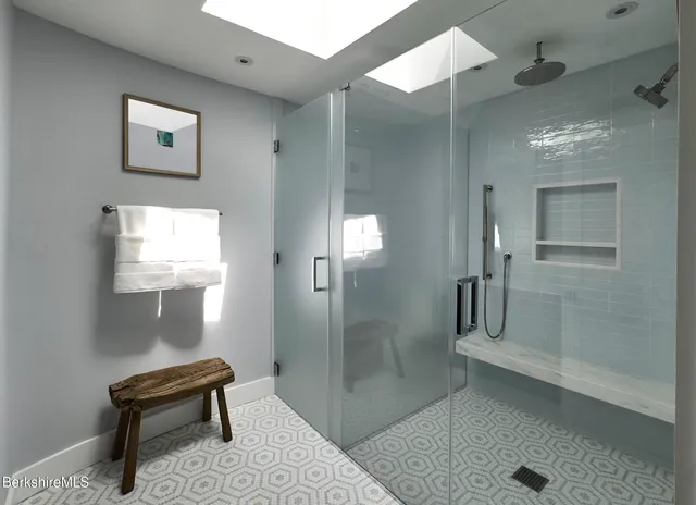 a bedroom with two beds and a bed