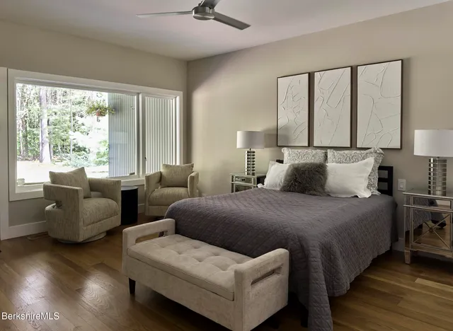 a view of a swimming pool and trees in the background
