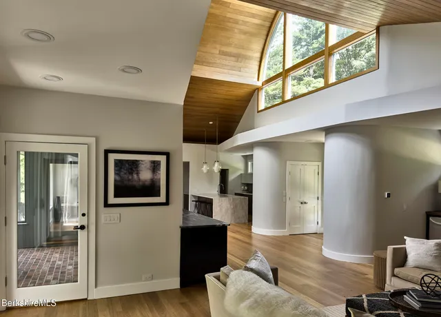 a kitchen with stainless steel appliances kitchen island granite countertop a stove and a sink