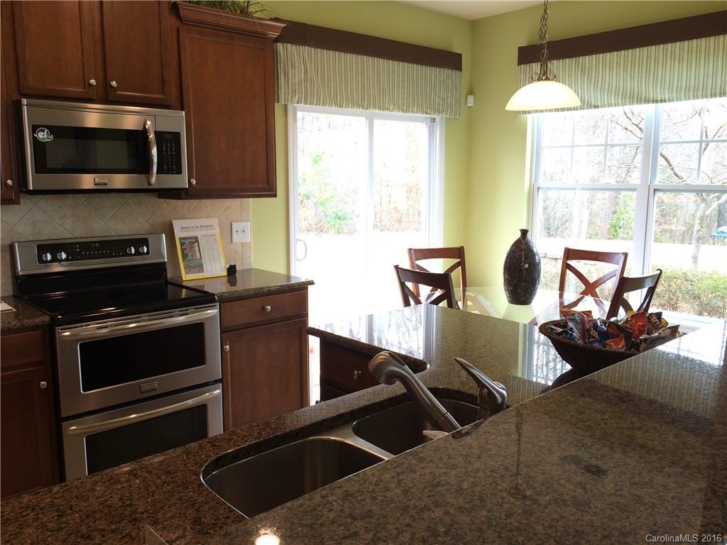 329 Stowe Road Belmont, NC 28012 - Photo 8 of 19 a kitchen with stainless steel appliances a stove a sink and a microwave