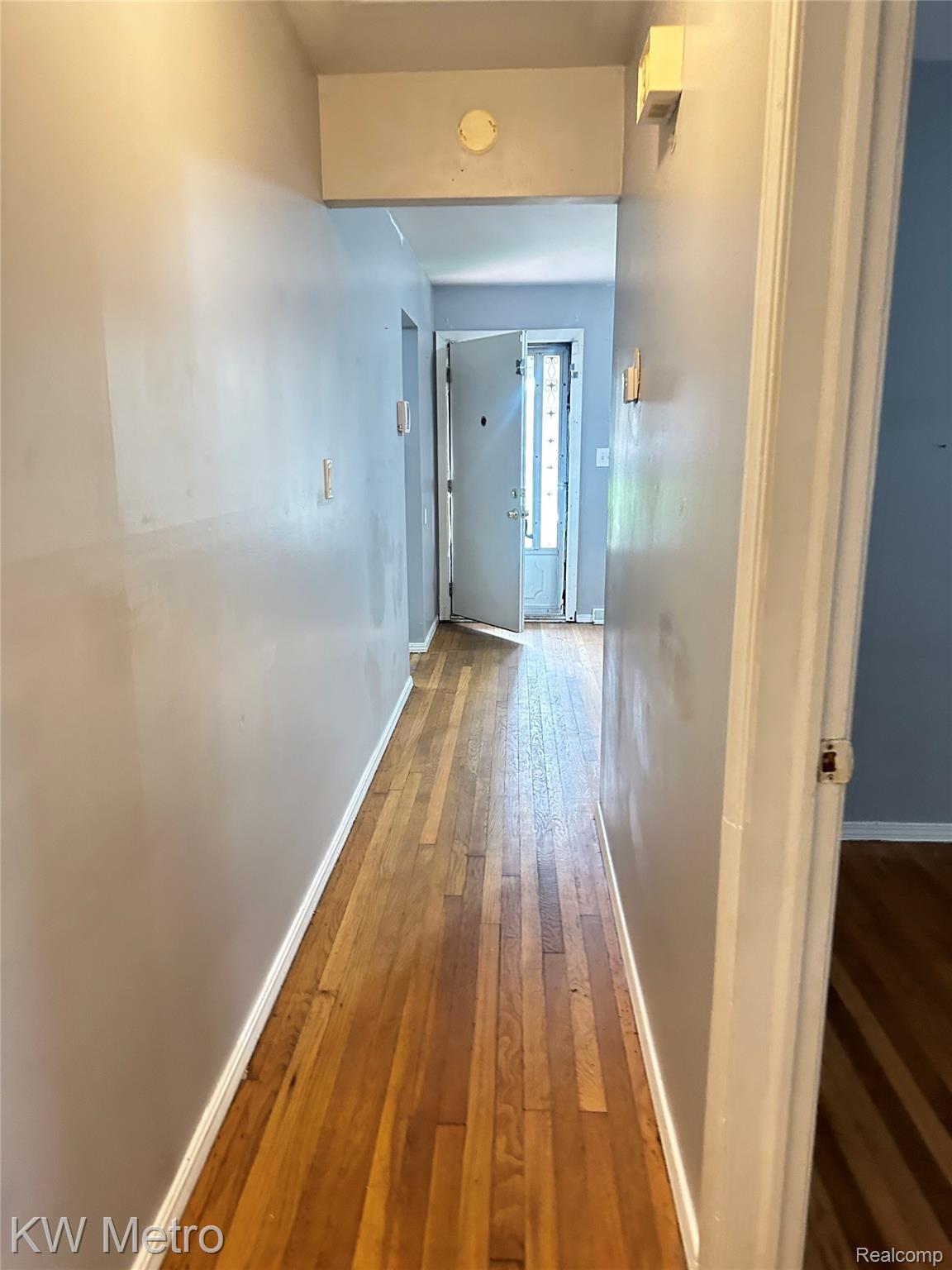78 Orchard Street River Rouge, MI 48218 - Photo 3 of 8 Wood-finish flooring extending through the hallway