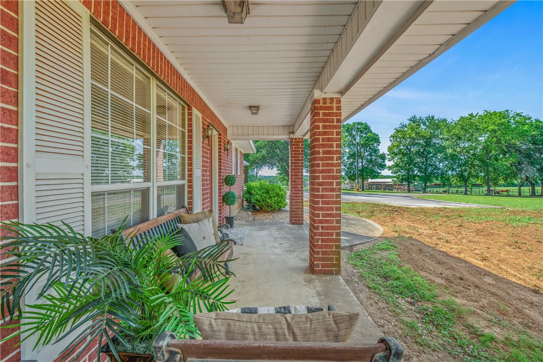 1110 County Road 439 Dime Box, TX 77853 - Photo 7 of 50 a view of a porch with a backyard