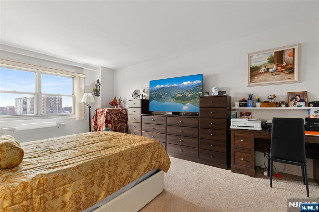 280 Prospect, Unit 9H Hackensack, NJ 07601 - Photo 15 of 37 a bedroom with a bed and furniture