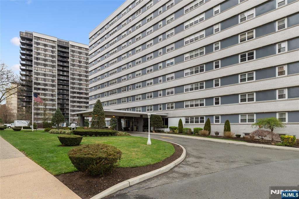 280 Prospect, Unit 9H Hackensack, NJ 07601 - Photo 2 of 37 a front view of a building with a garden
