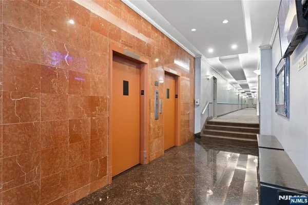 a view of a hallway with stairs