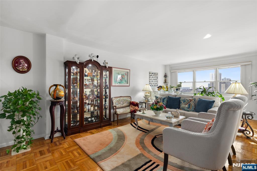 280 Prospect, Unit 9H Hackensack, NJ 07601 - Photo 4 of 37 a living room with furniture a rug and a window