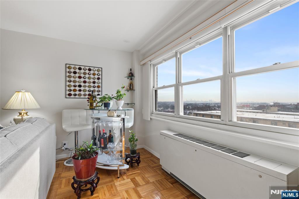 280 Prospect, Unit 9H Hackensack, NJ 07601 - Photo 7 of 37 a living room with furniture fireplace and a large window
