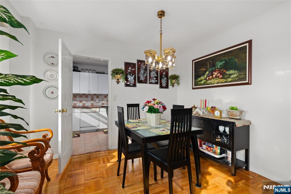 280 Prospect, Unit 9H Hackensack, NJ 07601 - Photo 8 of 37 a view of a dining room with furniture and chandelier