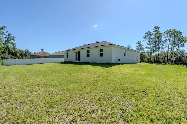 a large white building with a yard