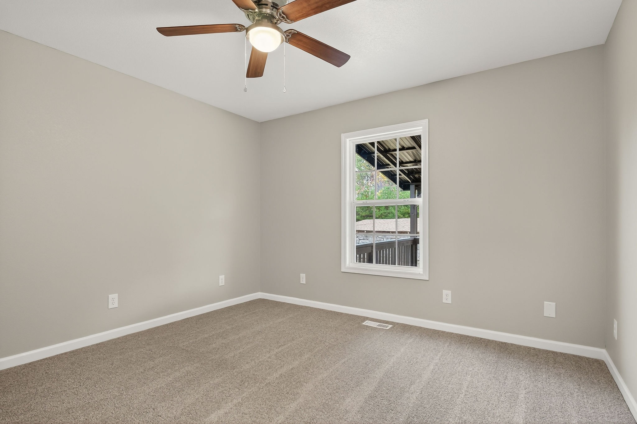 1193 Ashburn Road Monterey, TN 38574 - Photo 14 of 28 an empty room with a window and a fan