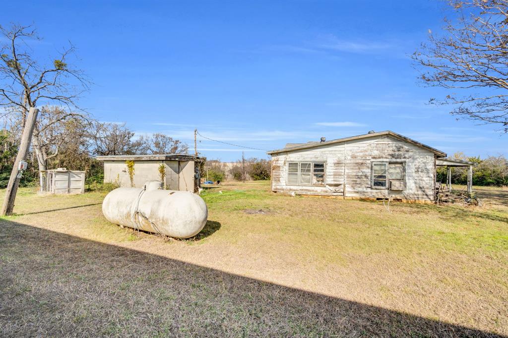 3107 Russell Road Arlington, TX 76001 - Photo 13 of 37 Propane Tank (in use), Old Water Well shed, Uninhabitable old house