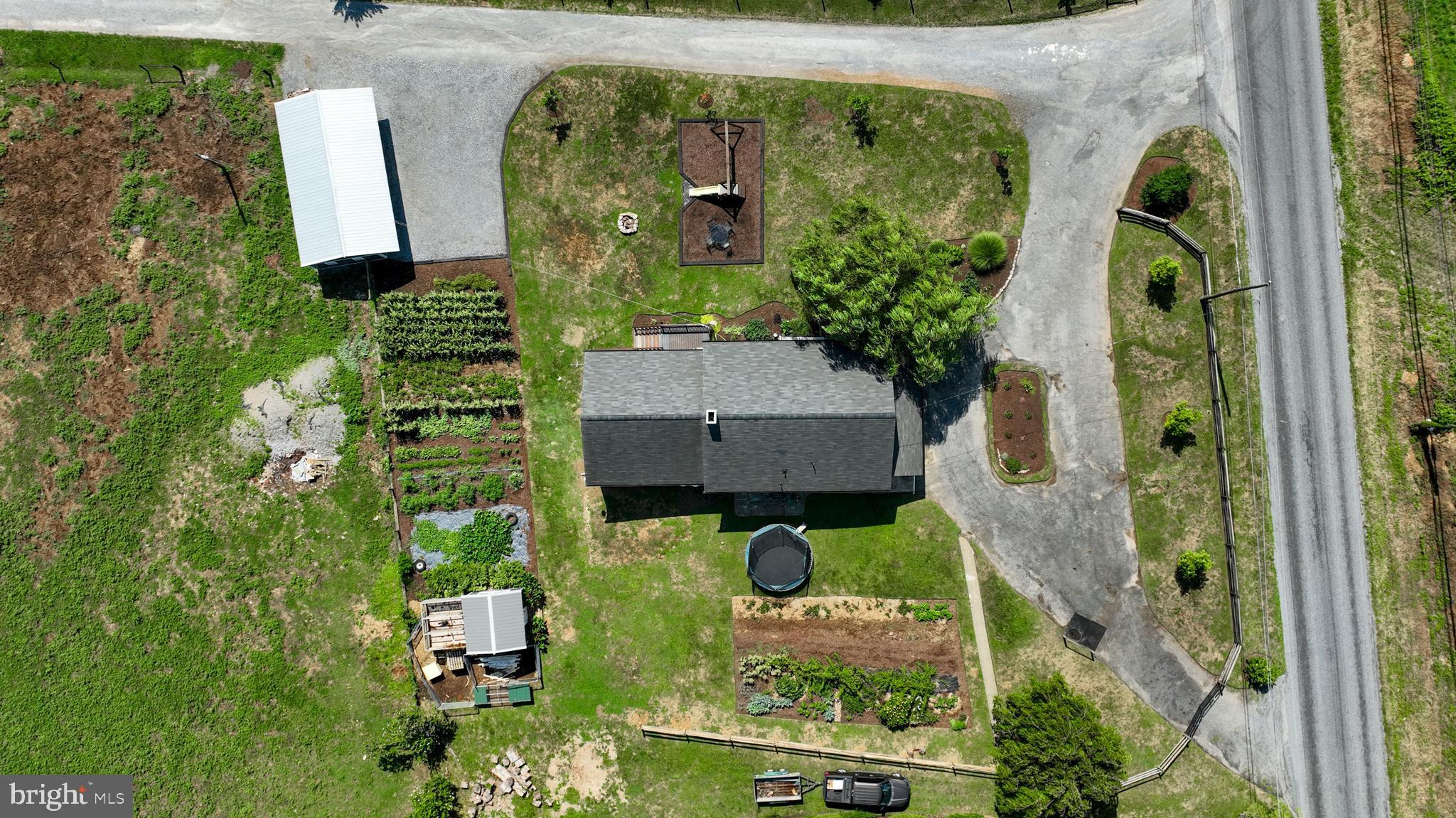 683 Fallowfield Road Atglen, PA 19310 - Photo 25 of 61 an aerial view of a house with garden space sitting space and swimming pool