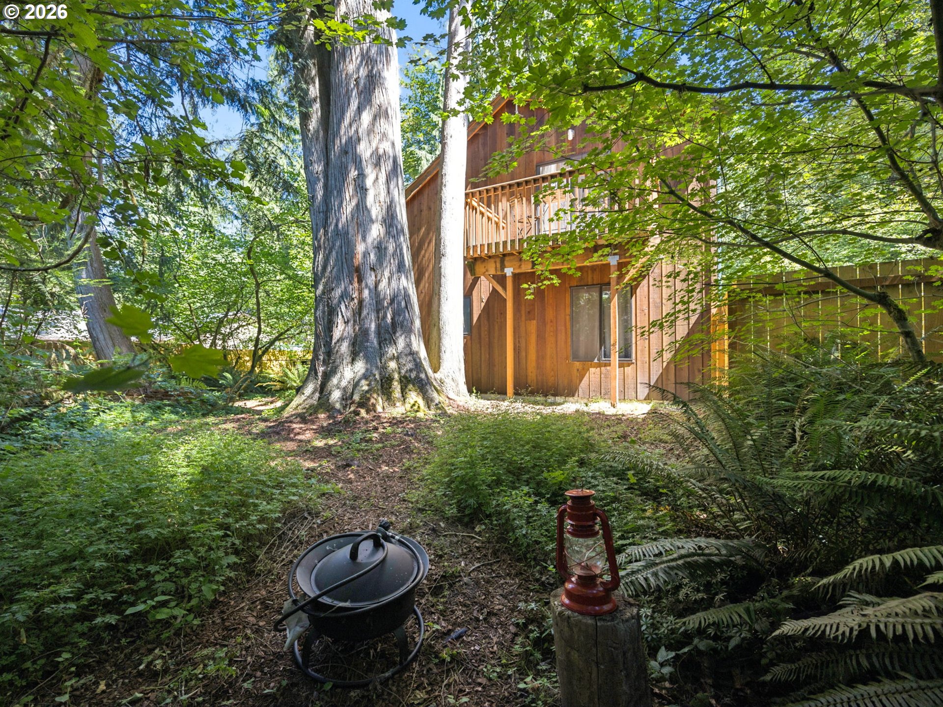 65582 East Timberline Drive Rhododendron, OR 97049 - Photo 37 of 47 a backyard of a house with lots of green space