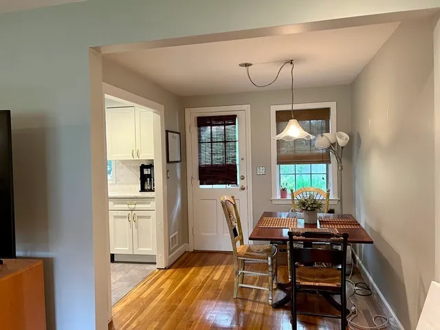 a living room with furniture a window and a table