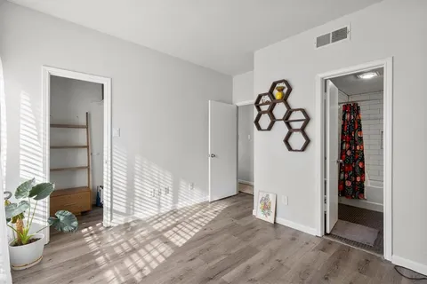 a view of entryway with furniture and front door
