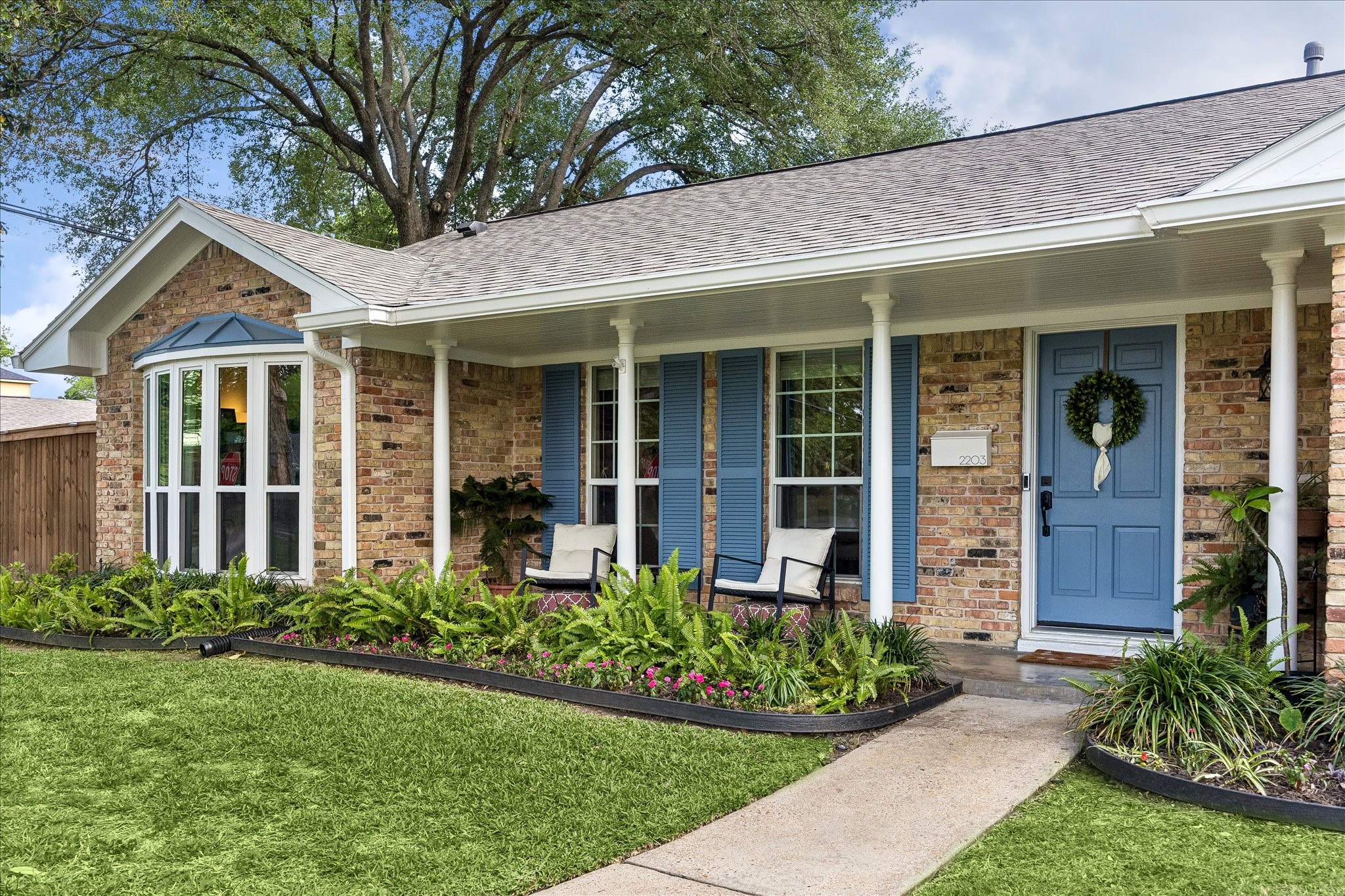 2203 Lamonte Lane Houston, TX 77018 - Photo 2 of 25 a front view of a house with garden