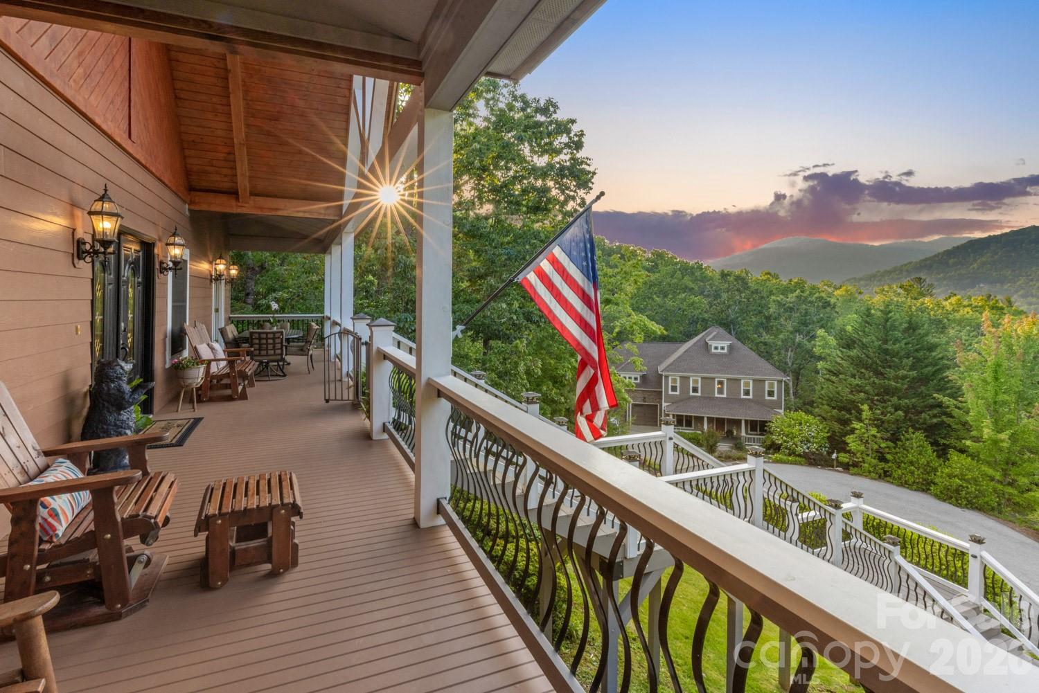 6 Grouse Terrace Fairview, NC 28730 - Photo 1 of 46 a balcony with wooden floor and outdoor seating