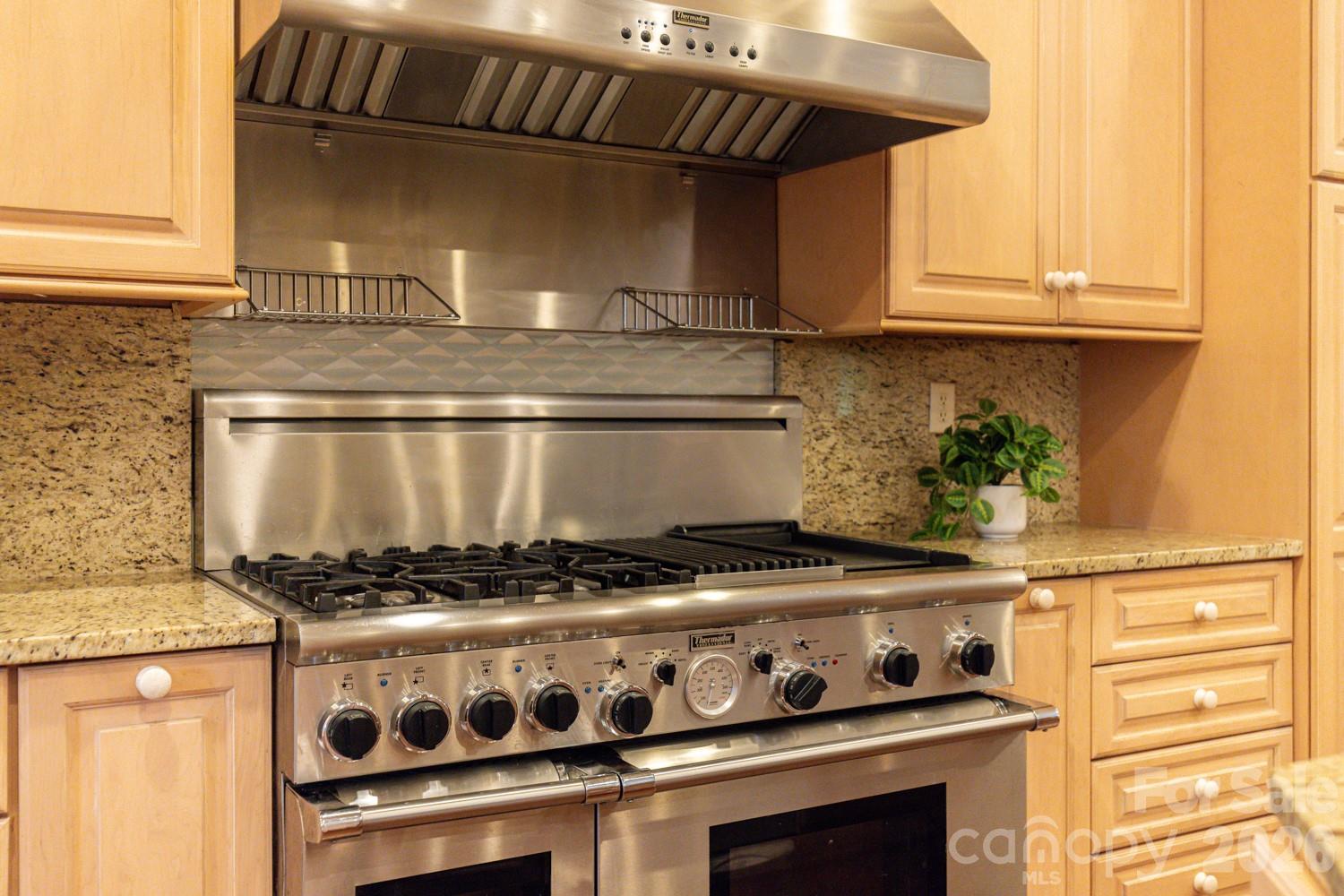 6 Grouse Terrace Fairview, NC 28730 - Photo 14 of 46 a stove top oven sitting inside of a kitchen