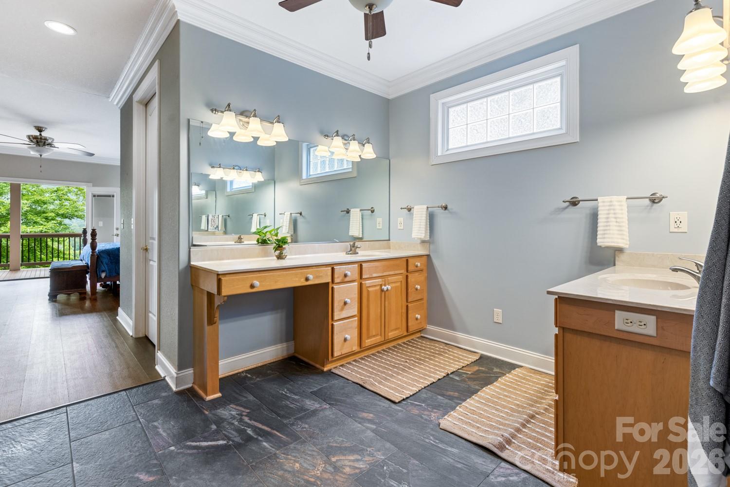 6 Grouse Terrace Fairview, NC 28730 - Photo 23 of 46 a bathroom with a sink vanity and a mirror