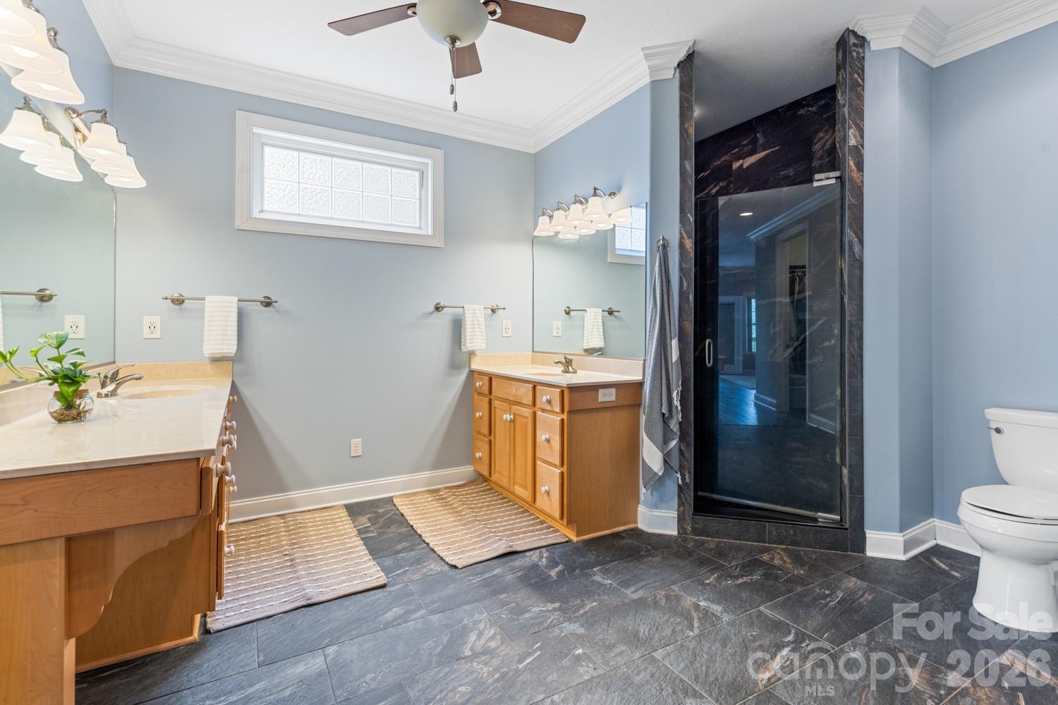 6 Grouse Terrace Fairview, NC 28730 - Photo 24 of 46 a view of a bathroom with a sink and a mirror