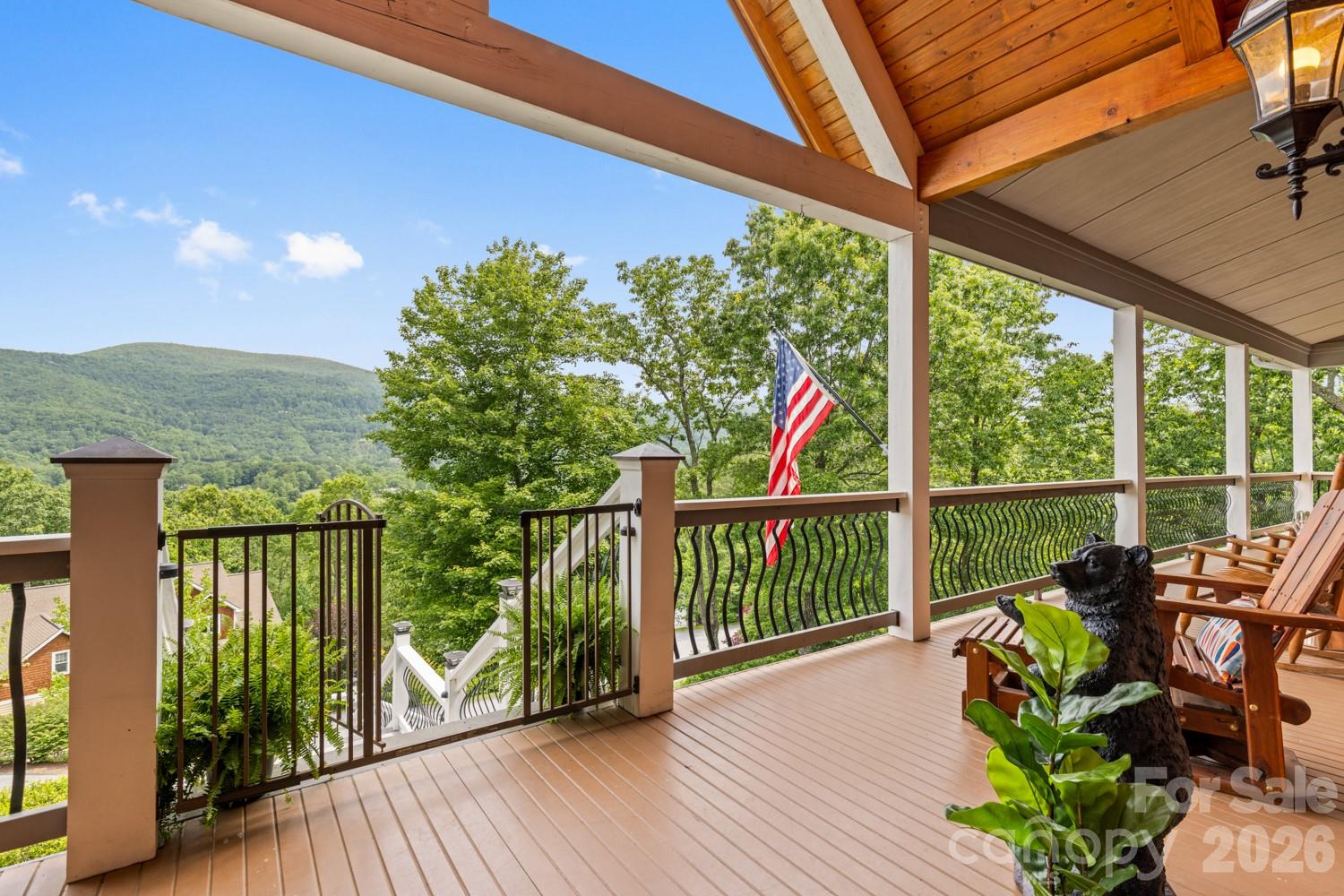 6 Grouse Terrace Fairview, NC 28730 - Photo 41 of 46 a view of a balcony with chairs and wooden floor