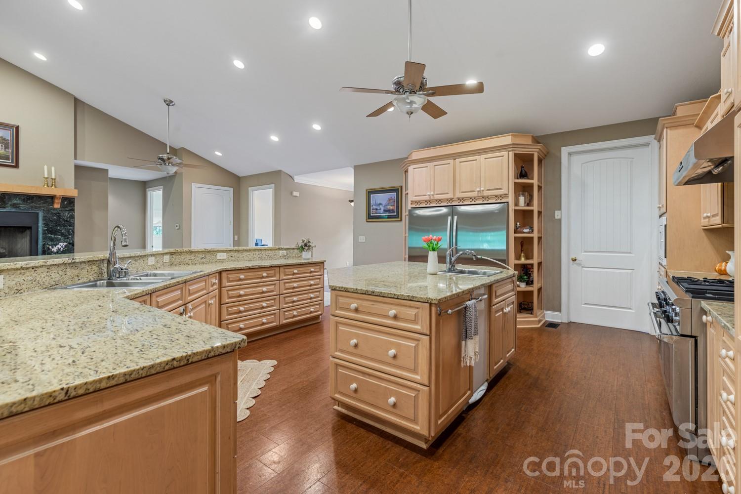 6 Grouse Terrace Fairview, NC 28730 - Photo 10 of 46 a kitchen with kitchen island granite countertop a stove and a sink
