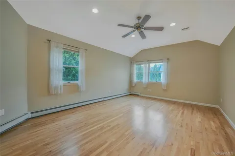 a spacious bathroom with a tub sink and shower