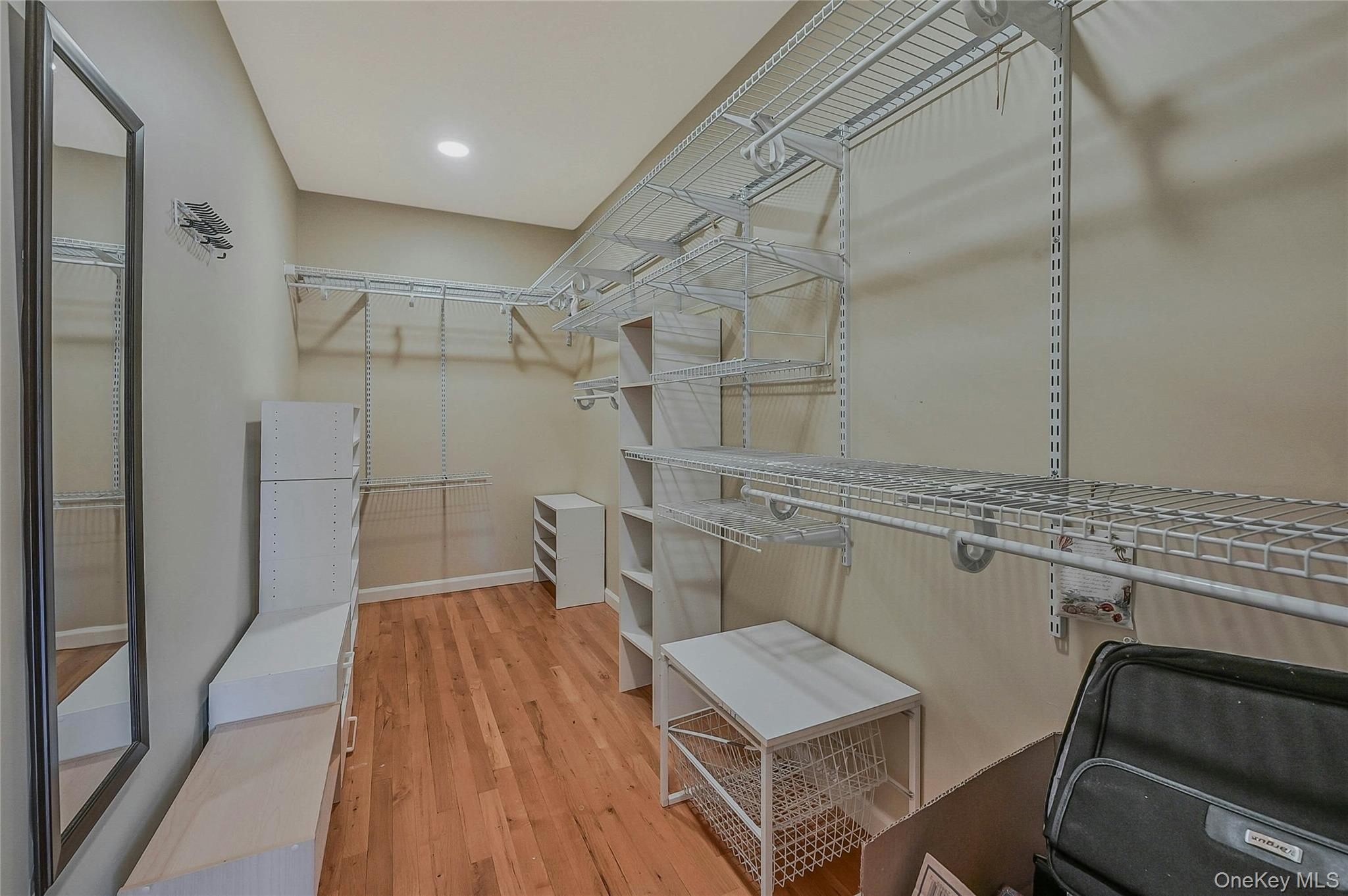 124 Fleets Cove Road Huntington, NY 11743 - Photo 21 of 35 a room with cabinets and wooden floor