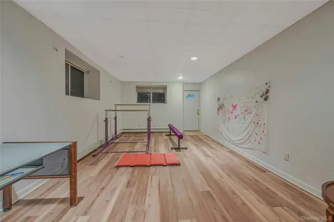a view of a room with wooden floor and cabinet