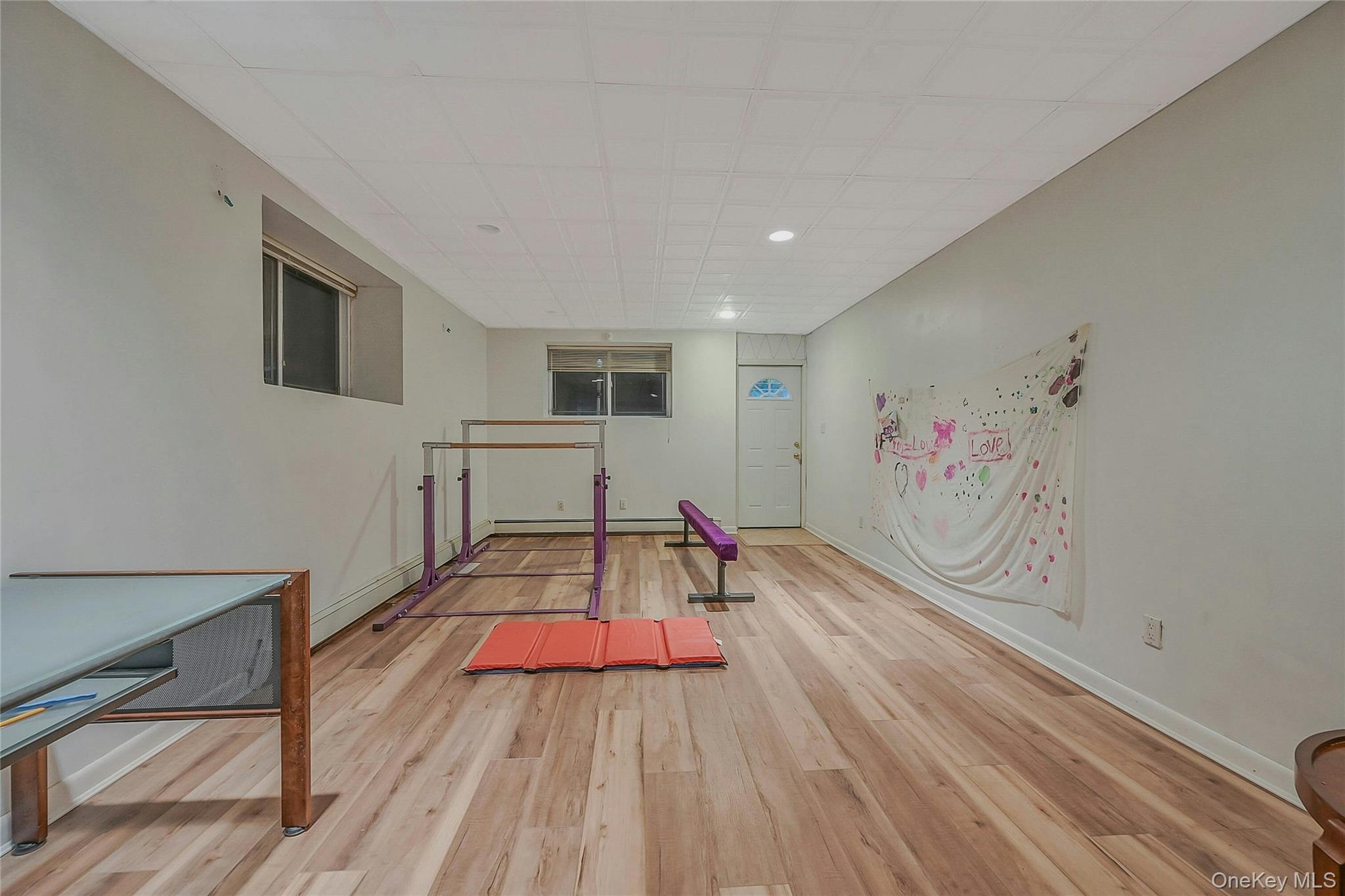 124 Fleets Cove Road Huntington, NY 11743 - Photo 26 of 35 a view of a livingroom with wooden floor and furniture