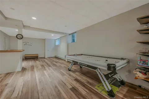 a bathroom with a sink toilet and a mirror