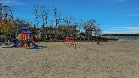 a view of swimming pool with seating space