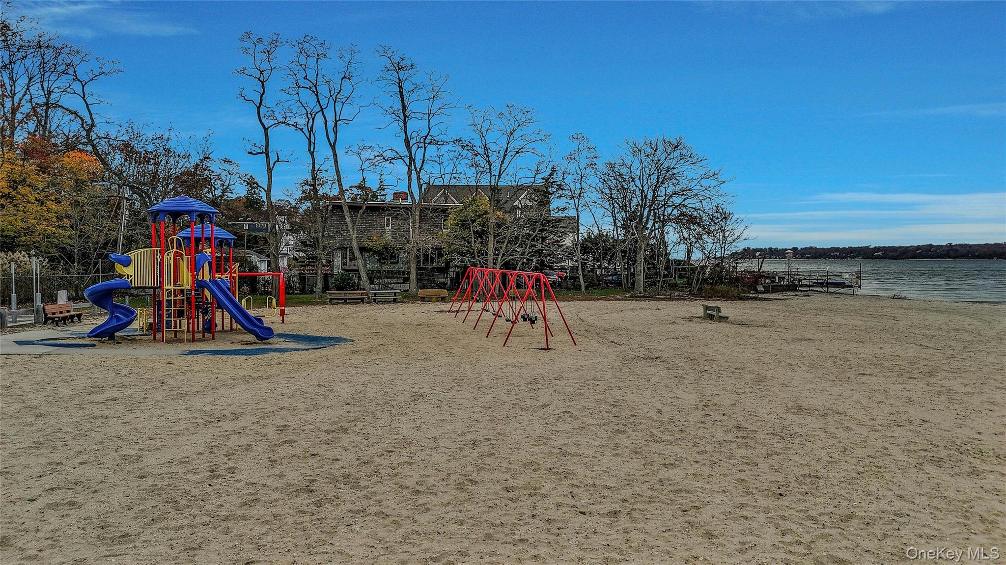 124 Fleets Cove Road Huntington, NY 11743 - Photo 4 of 35 a view of outdoor space with playground and green space