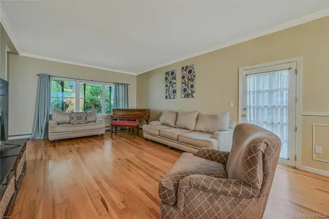 a living room with furniture flat screen tv and a fireplace