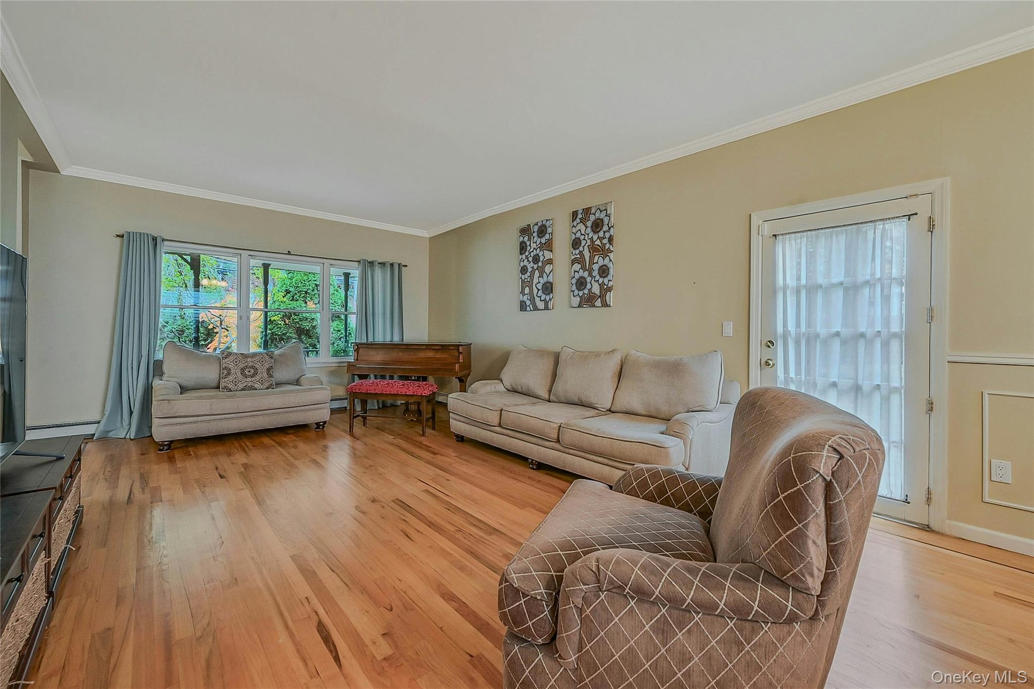 124 Fleets Cove Road Huntington, NY 11743 - Photo 8 of 35 a living room with furniture and a wooden floor