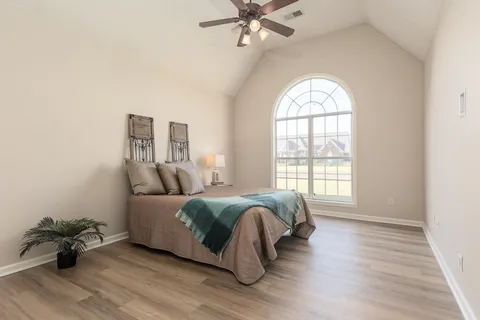 a bed room with a bed and a window