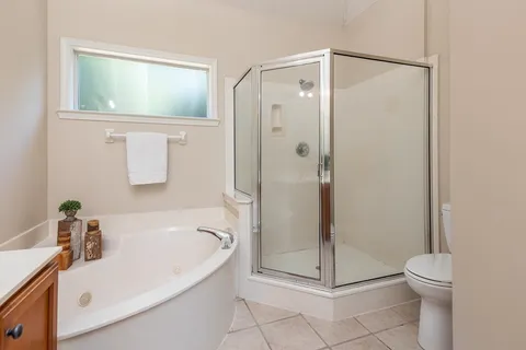 a bathroom with a bathtub and a shower