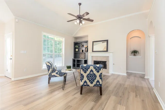 a view of a livingroom with furniture and a fireplace