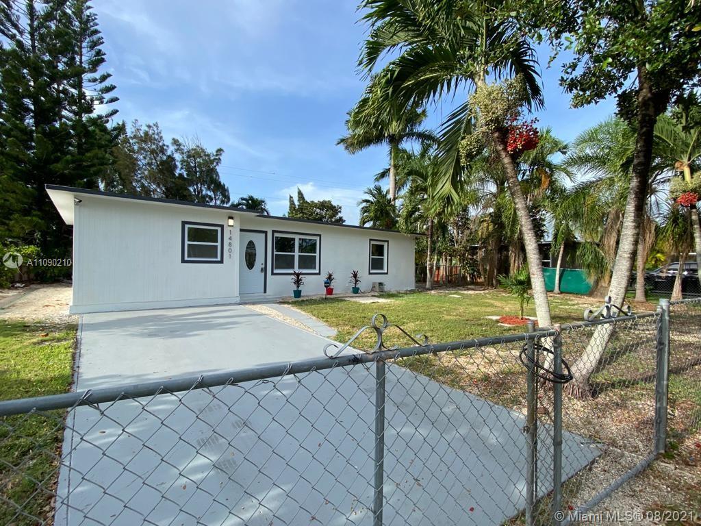 14801 Harding Lane Homestead, FL 33033 - Photo 3 of 26 a view of a house with backyard and a tree