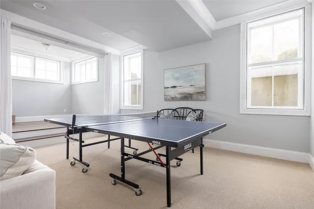 a view of a livingroom with furniture and a window
