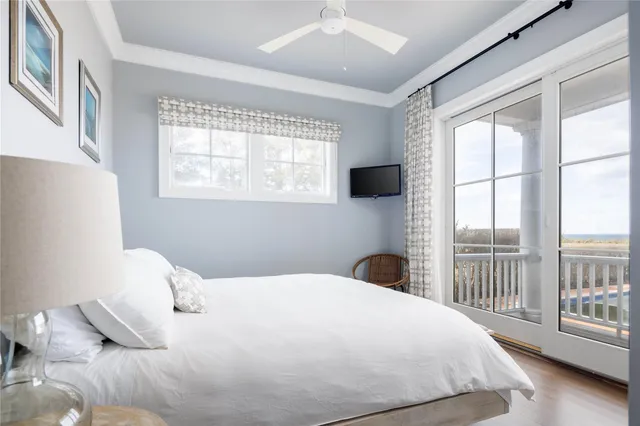 a bedroom with a large bed and a large window