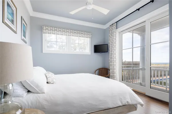 a bedroom with a large bed and a large window