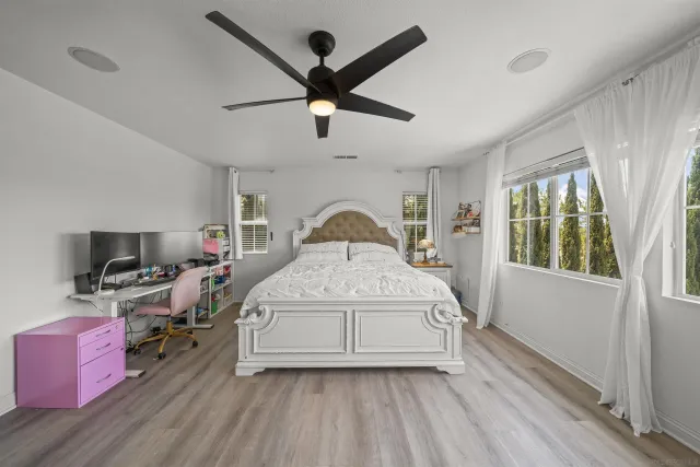 a spacious bathroom with a granite countertop sink a toilet and shower