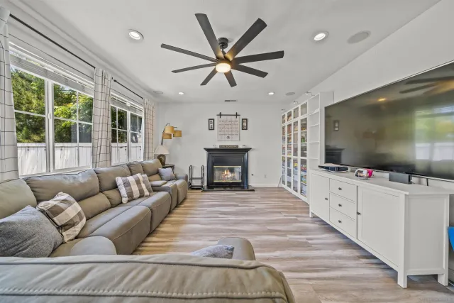 a bedroom with furniture and a large window