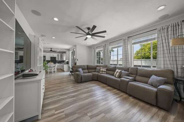 a bed room with furniture and a wooden floor