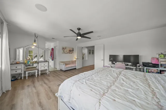 a bathroom with a double vanity sink mirror and toilet