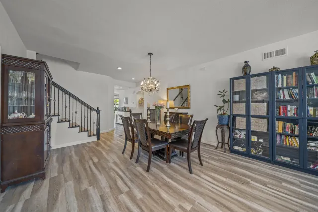 a kitchen with a refrigerator and a sink