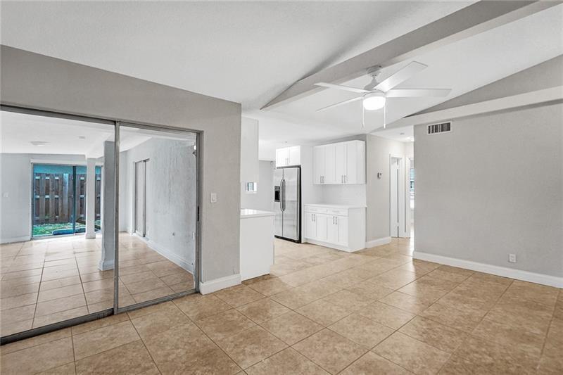 8221 Southwest 3rd Court Pompano Beach, FL 33068 - Photo 11 of 25 a view of a hallway with wooden shelves