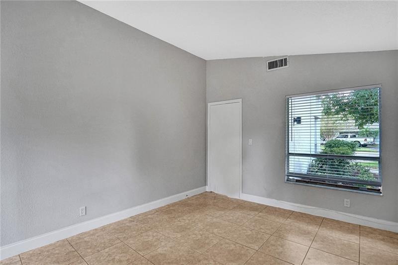 8221 Southwest 3rd Court Pompano Beach, FL 33068 - Photo 16 of 25 a view of an empty room with a window
